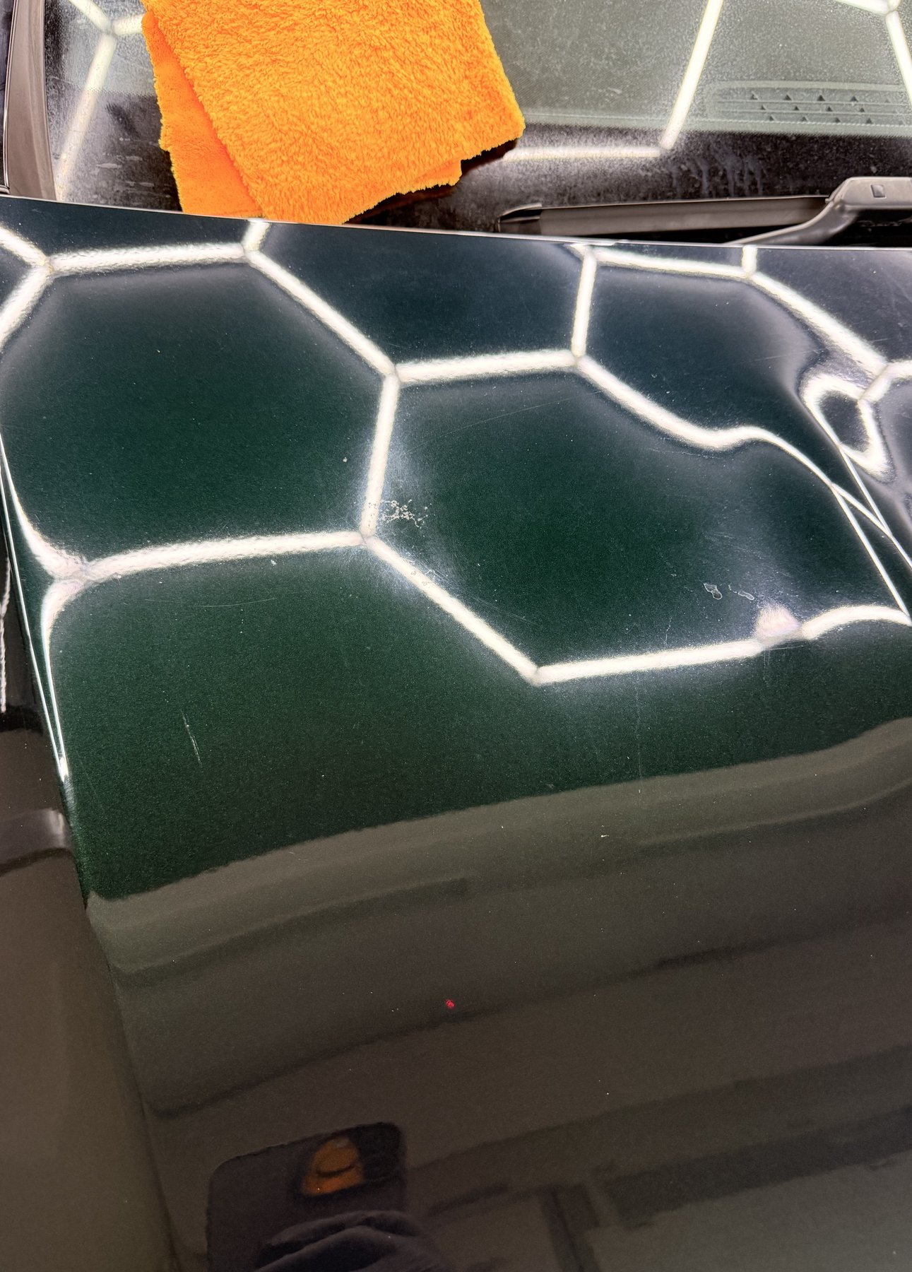 Paintwork before correction showing swirl marks and light scratches